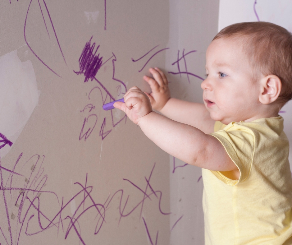Baby drawing on the wall