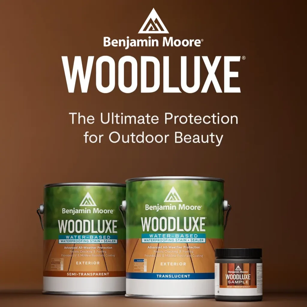 Person staining wood with brush