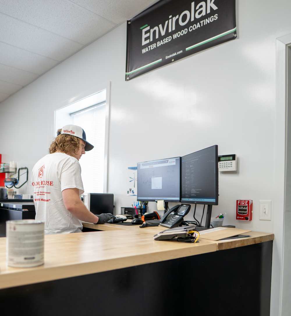 Person working at a reception desk