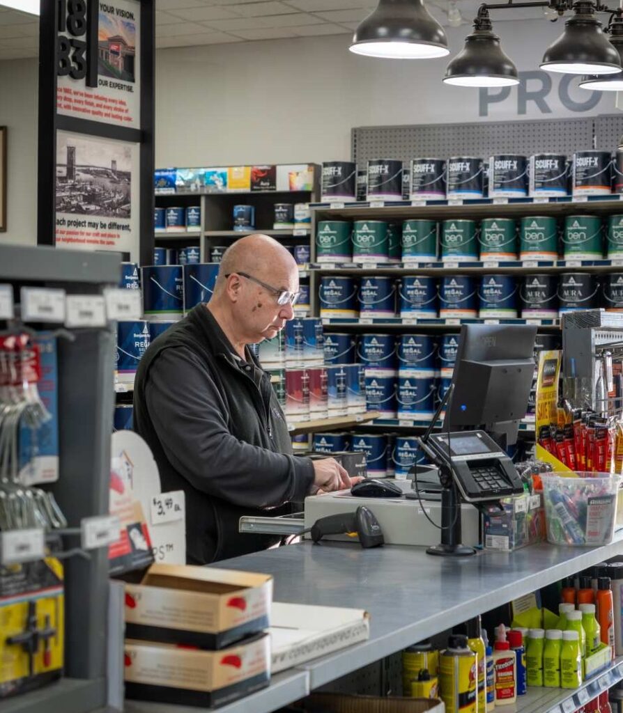 Man at hardware store checkout counter